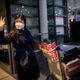 Filipino nurse April Glory waves to her family before leaving for the UK, outside Ninoy Aquino International Airport in Pasay City, Metro Manila, Philippines August 20, 2020, after the government partially eased restrictions on health workers' movements. "I hope the government will not take it against us that we are leaving", she said. Picture taken August 20, 2020.